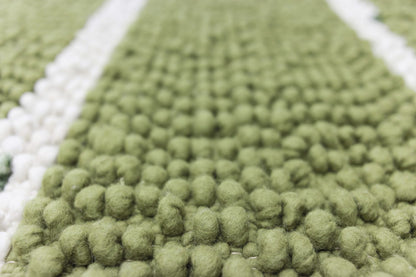 Schlingen-Effekt-Teppich aus Schurwolle, grün/weiß